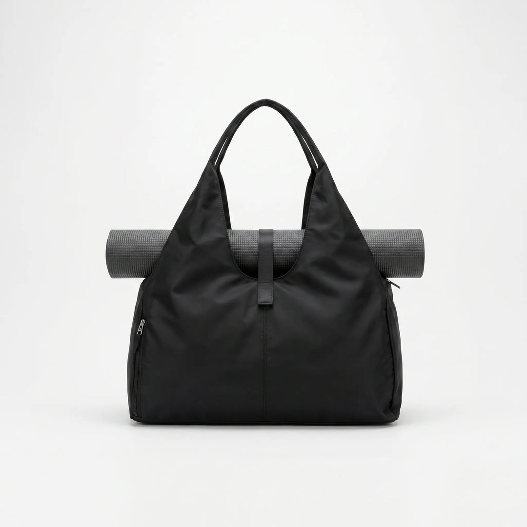 Stylish women's large capacity duffel bag. Versatile gym, yoga or travel shoulder bag with ample storage.
