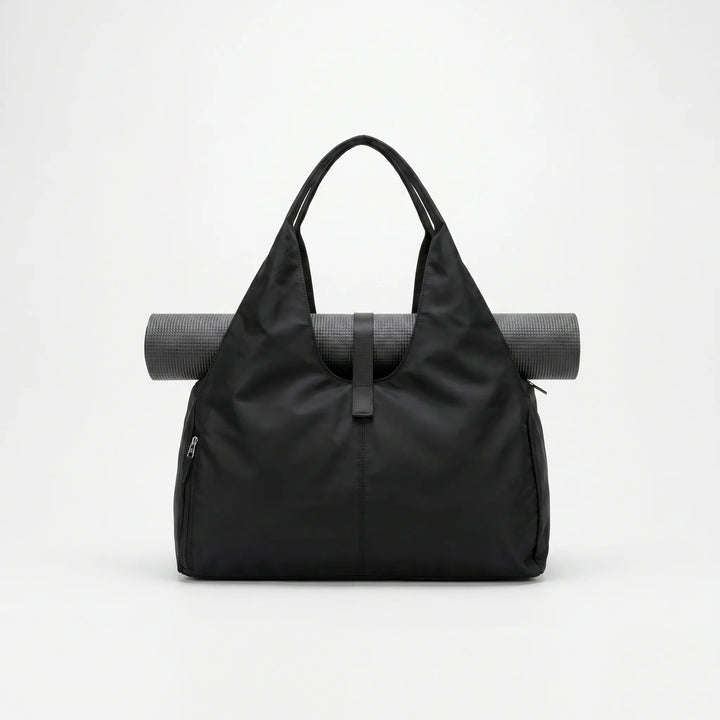 Stylish women's large capacity duffel bag. Versatile gym, yoga or travel shoulder bag with ample storage.