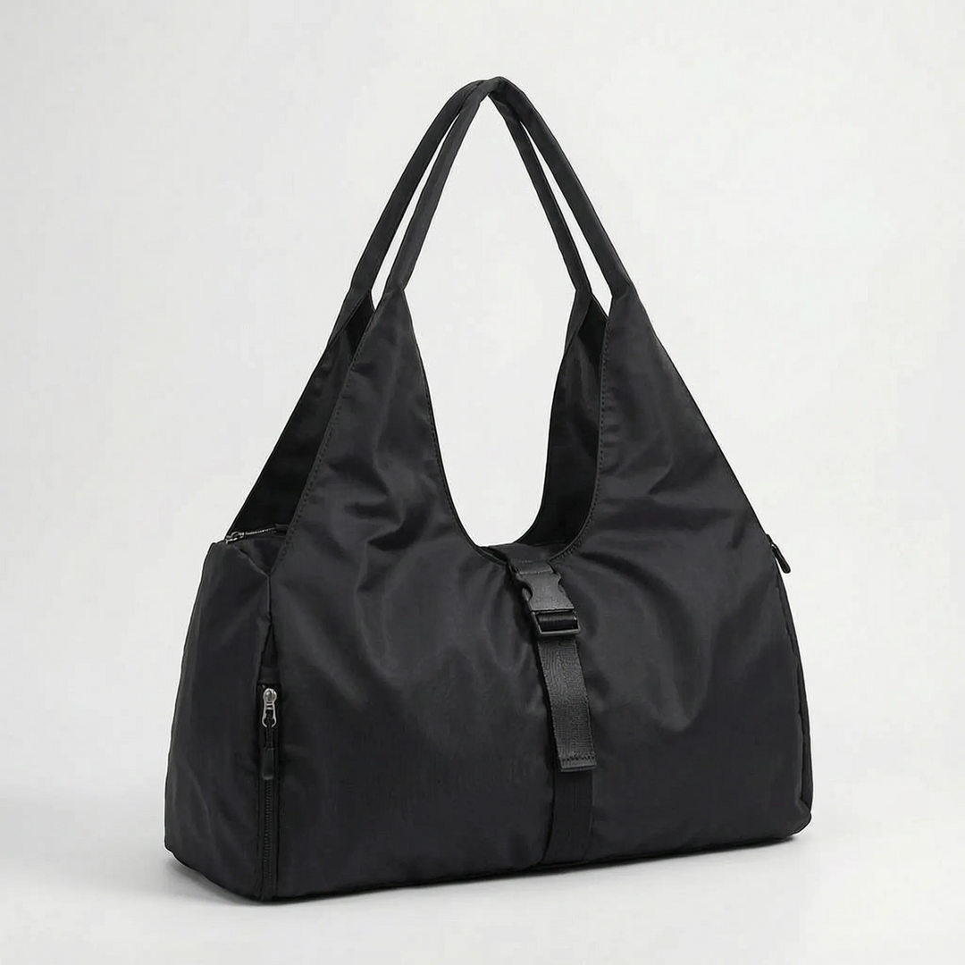 Women's large capacity duffel bag for gym, travel & sports. Convenient shoulder bag for all your workout essentials.