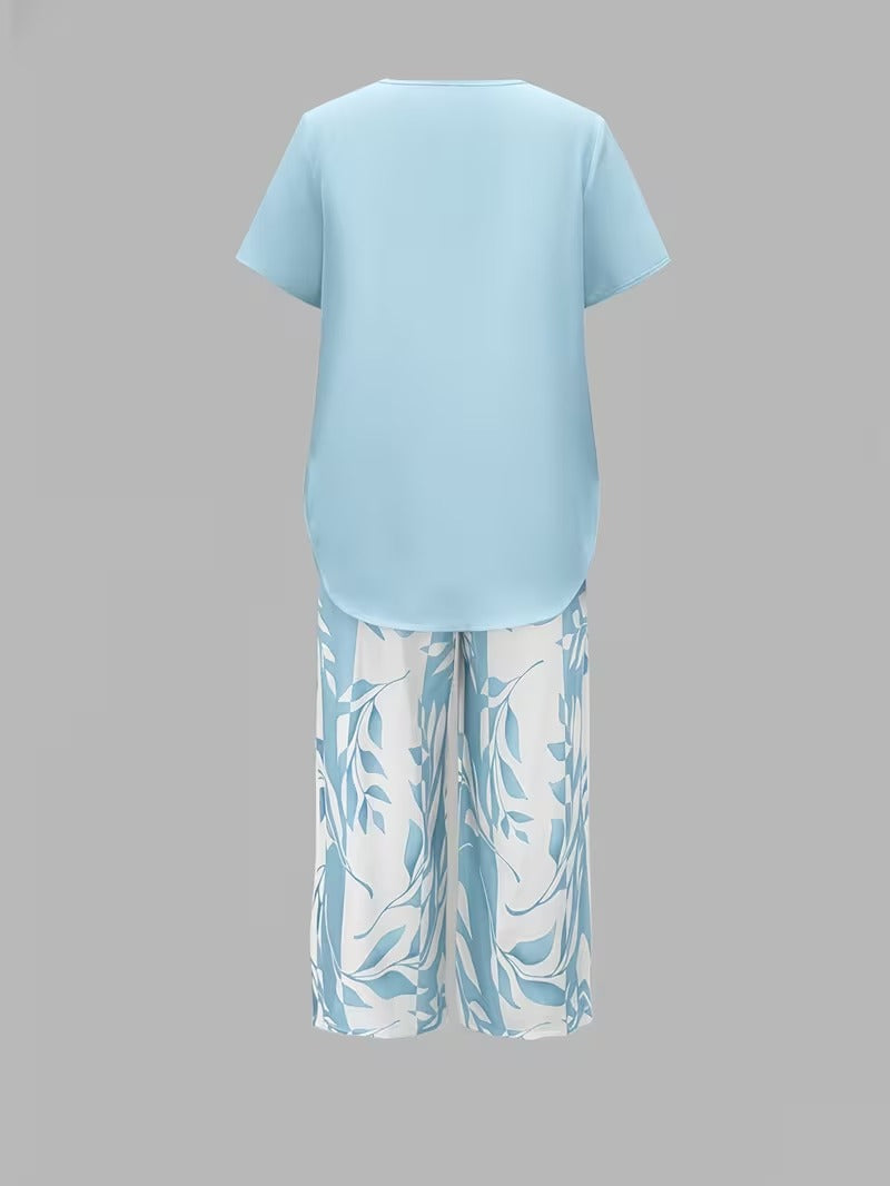 Women's casual leaf print matching set. Short sleeve top and cropped pants for relaxed wear.