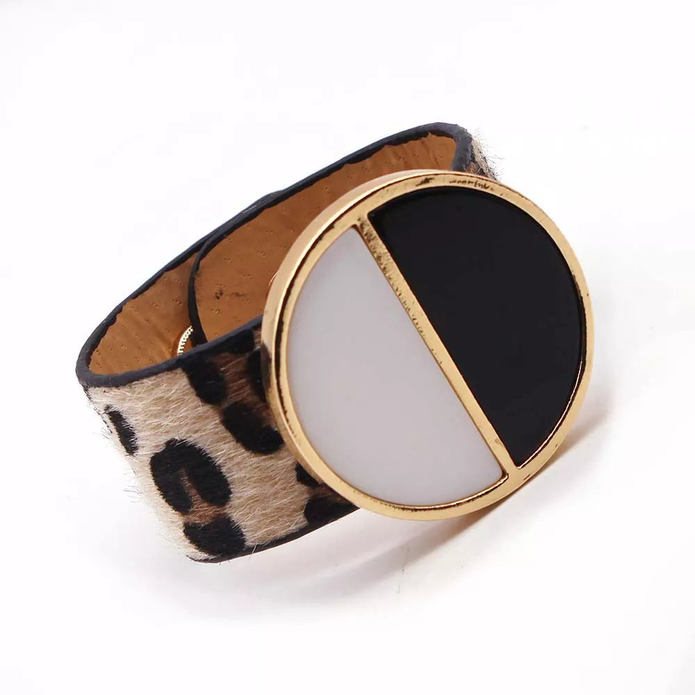 Fashionable women's adjustable leopard print leather wrap bracelet. Perfect animal print accessory.