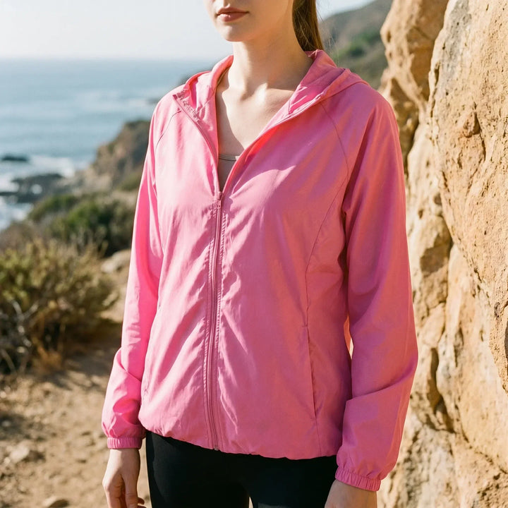 Women's lightweight hooded active jacket, perfect for running & outdoor activities. Breathable windbreaker.