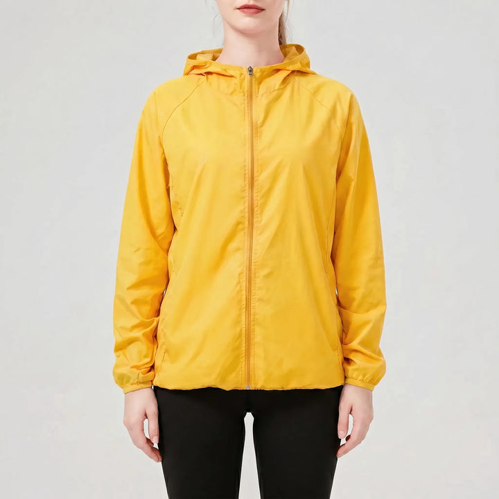 Durable women's lightweight hooded active jacket. A packable windbreaker, ideal for spring sports, travel, and casual style.
