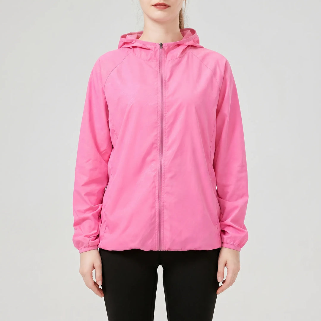 Comfortable women's hooded lightweight active jacket. Essential sportswear for running, travel & outdoor adventures.