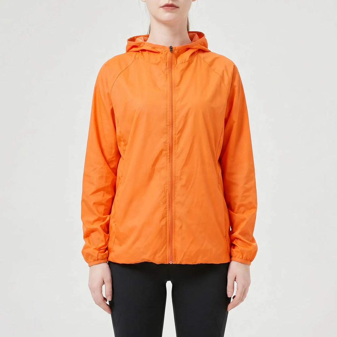 Performance women's lightweight hooded jacket. Essential activewear for running, hiking, and casual outdoor comfort.