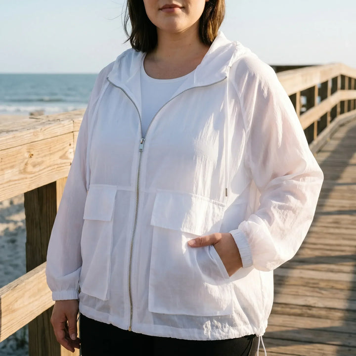 Women's lightweight hooded sports jacket for active outdoors, ideal for running & athletic wear.