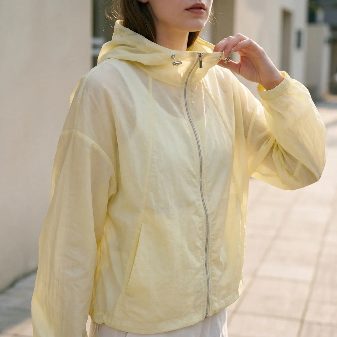 Women's lightweight hooded windbreaker jacket with zipper, perfect for spring and summer activewear.