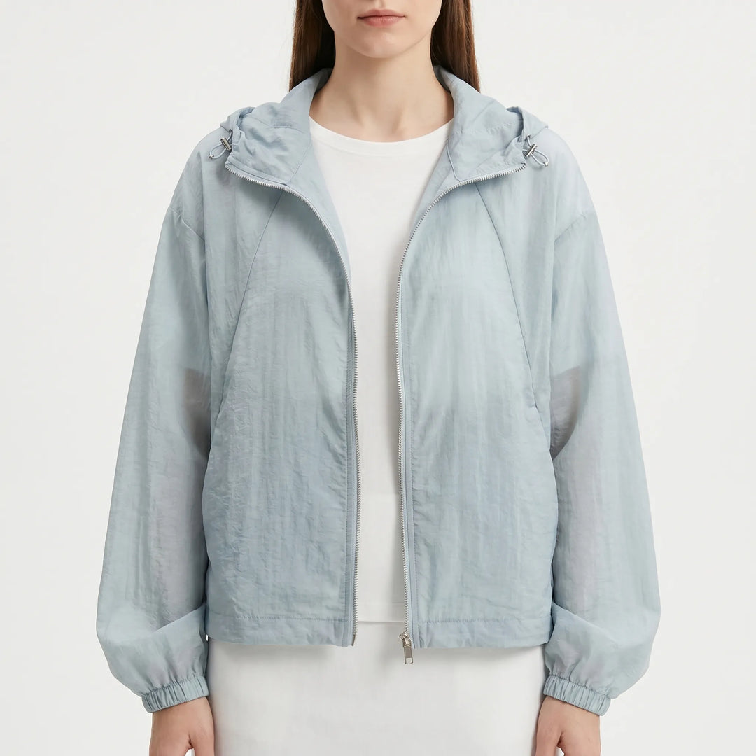 Vibrant pink women's lightweight hooded windbreaker, a versatile zippered jacket for active spring days.