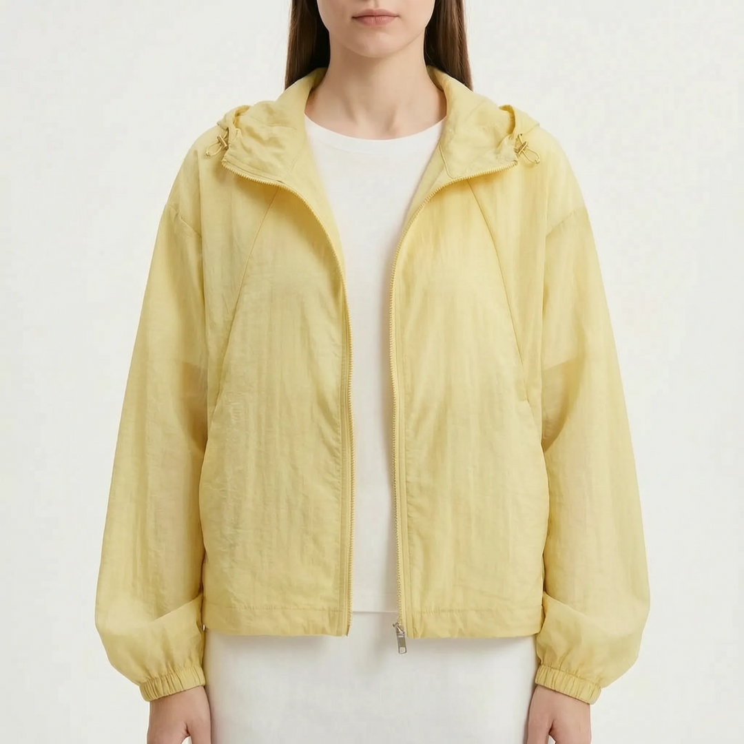 Comfortable women's lightweight hooded windbreaker jacket with full zipper, great for sporty casual wear.