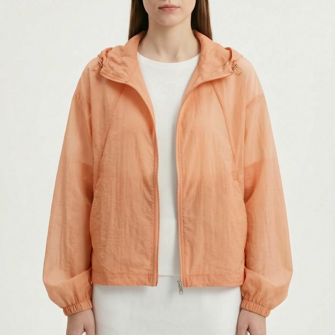 Lightweight hooded windbreaker for women, a zippered sporty jacket designed for active casual wear in spring/summer.