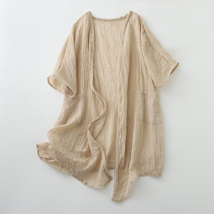 Versatile women's beige open-front cardigan with pockets, perfect for comfortable all-season layering.