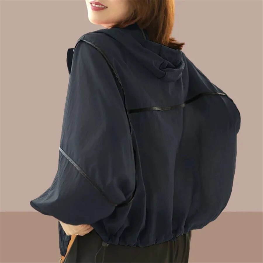 Casual women's zip-up oversized hoodie jacket for summer, offering comfortable, lightweight outerwear and style.