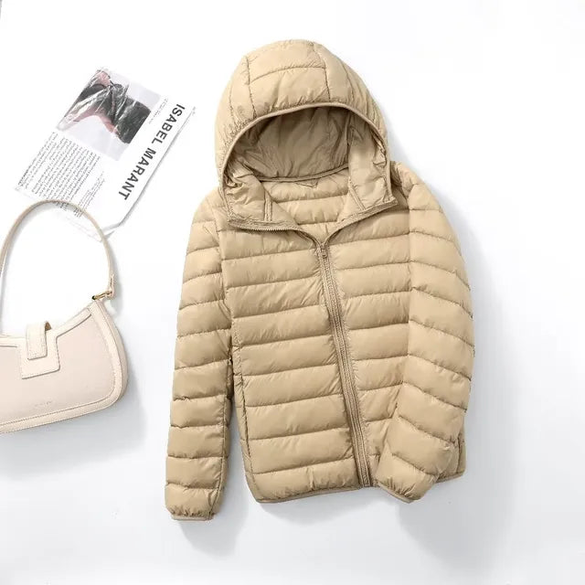 Women's travel-friendly hooded jacket. Lightweight, packable, essential outerwear for trips.