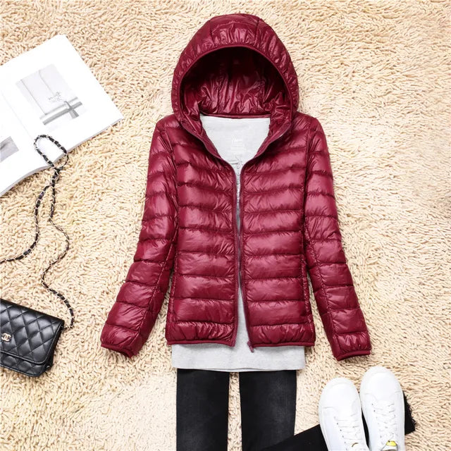 Durable women's outdoor jacket. Lightweight, packable, hooded for hiking & adventure.