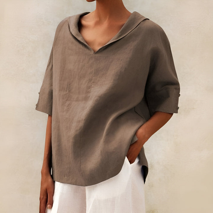 Fashionable women's lightweight short sleeve blouse. Chic and comfortable ladies' top for versatile everyday summer style.