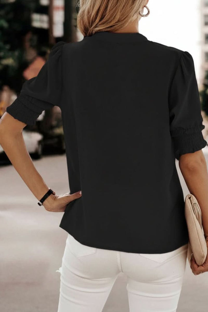 Flowy lightweight V-neck blouse for women. Elegant puff sleeves make this a comfortable summer or casual chic top.