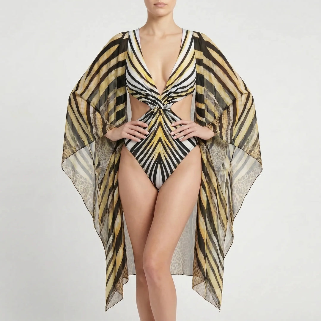 Chic women's long-sleeve abstract print monokini with cutouts, flared sleeves & deep V-neck.