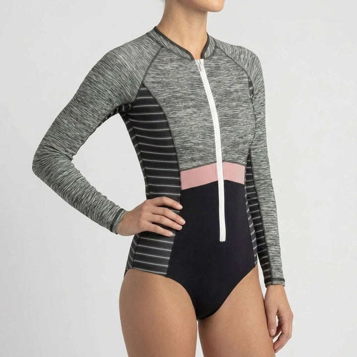 Sporty long-sleeve women's one-piece rash guard, zipper, ideal for athletic beachwear & sun protection.