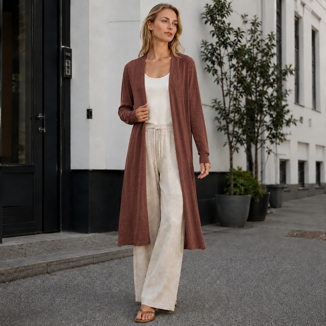Stylish women's full-length knit cardigan, perfect for cozy layering in cool weather.