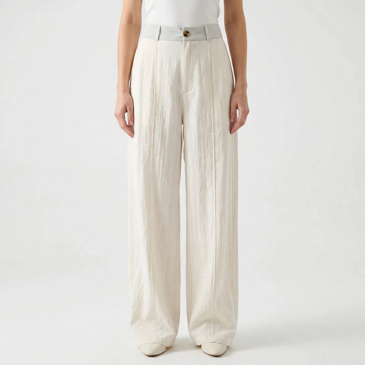 Airy white women's wide leg pants with a loose fit and mid-rise for comfortable summer fashion.