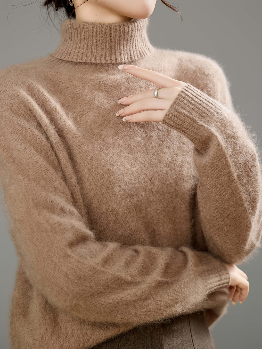 Relaxed fit women's turtleneck sweater. Ideal for comfortable layering & stylish cold weather outfits.