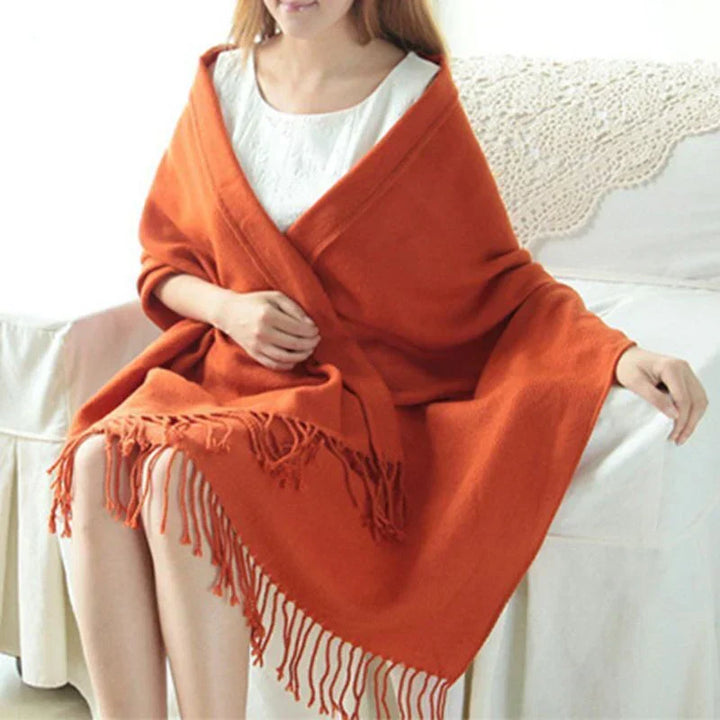 Luxurious soft texture of a women's cashmere check pattern scarf, warm & elegant for winter.