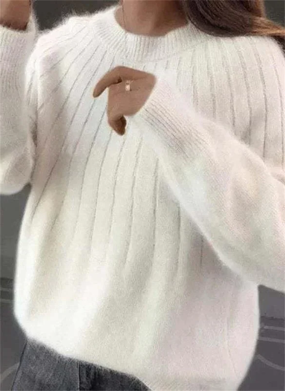 Versatile women's luxury knit sweater, a soft cashmere piece offering cozy warmth and casual chic winter style.
