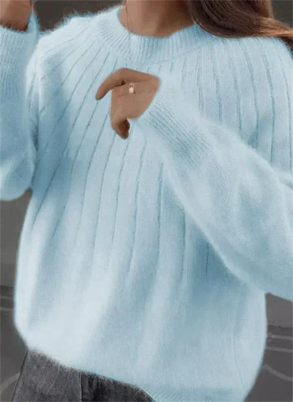 Women's luxurious soft cashmere sweater, providing warmth and comfort. An elegant, long-sleeve knit for winter.