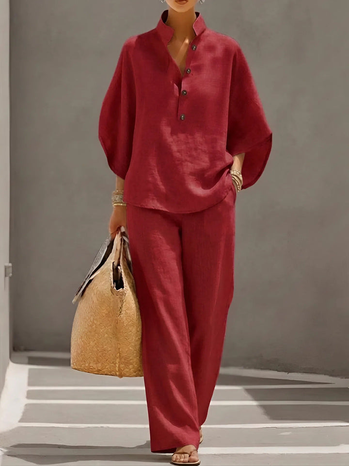 Sophisticated women's two-piece set, mandarin collar blouse with comfortable wide-leg trousers.