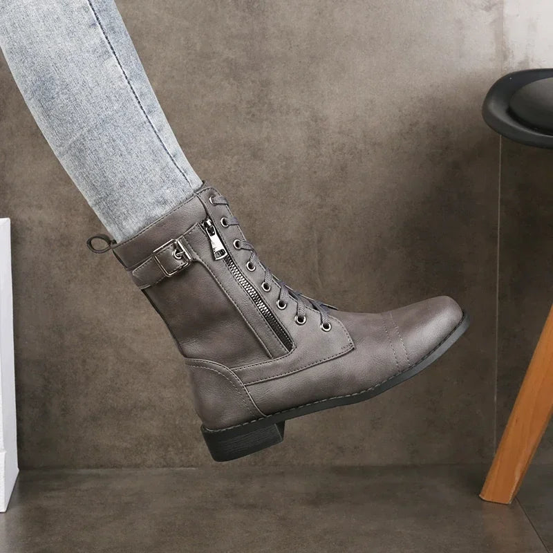 Women's Mason mid-calf boots featuring lace-up front, practical side zipper & buckle straps. Durable edgy style.