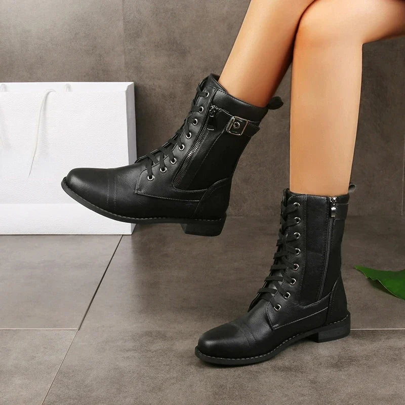 Detailed view of women's Mason mid-calf boot, highlighting texture, laces, zipper, and buckle accents.
