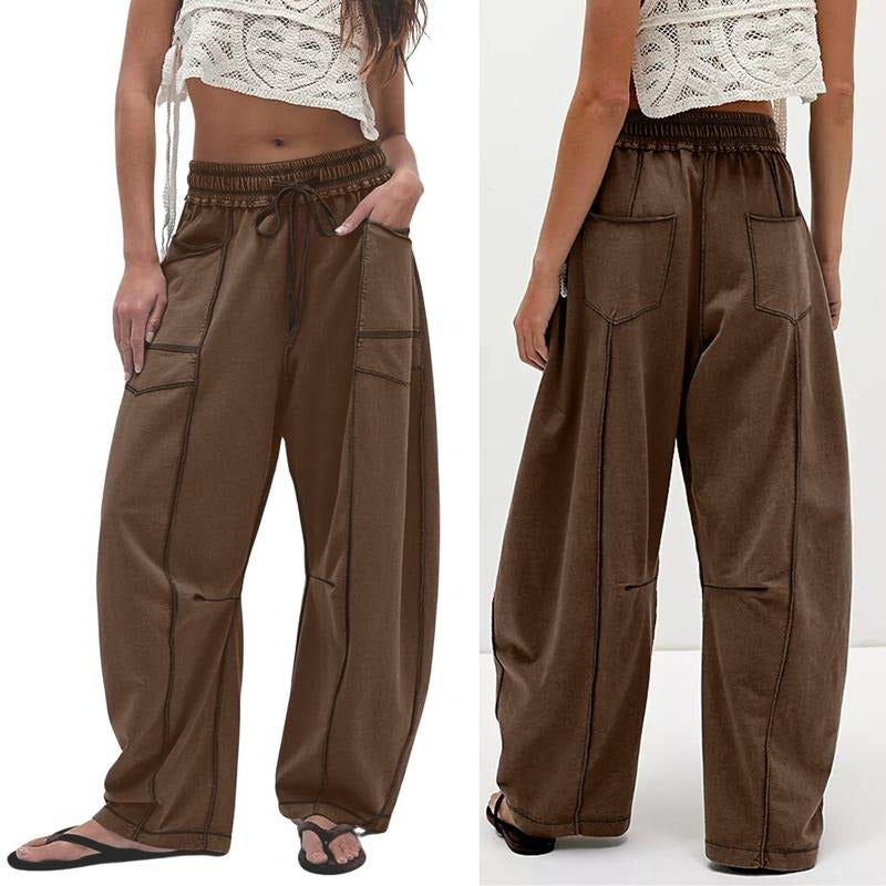 Comfortable women's barrel leg trousers, modern utility design, relaxed fit for streetwear fashion.