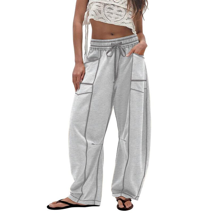 Women's modern utility pants featuring a unique barrel leg cut and comfortable relaxed fit.