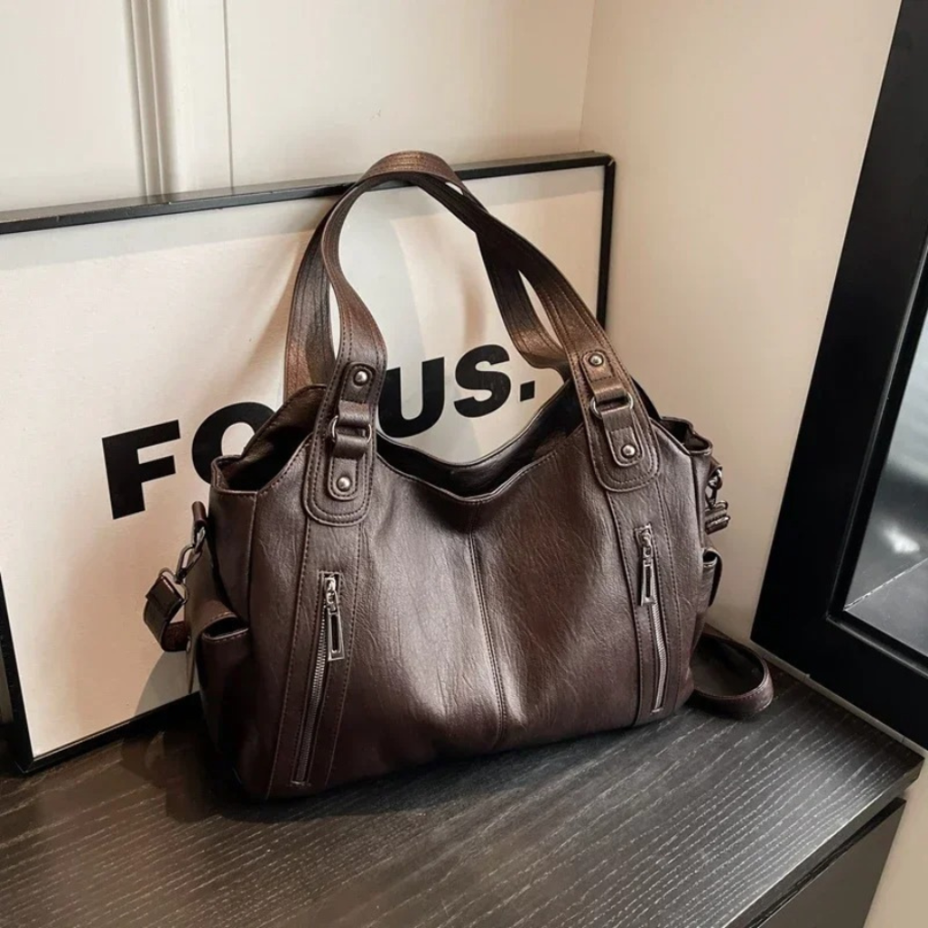 Versatile women's shoulder bag with multiple sections for superior organization; a fashion-forward accessory.