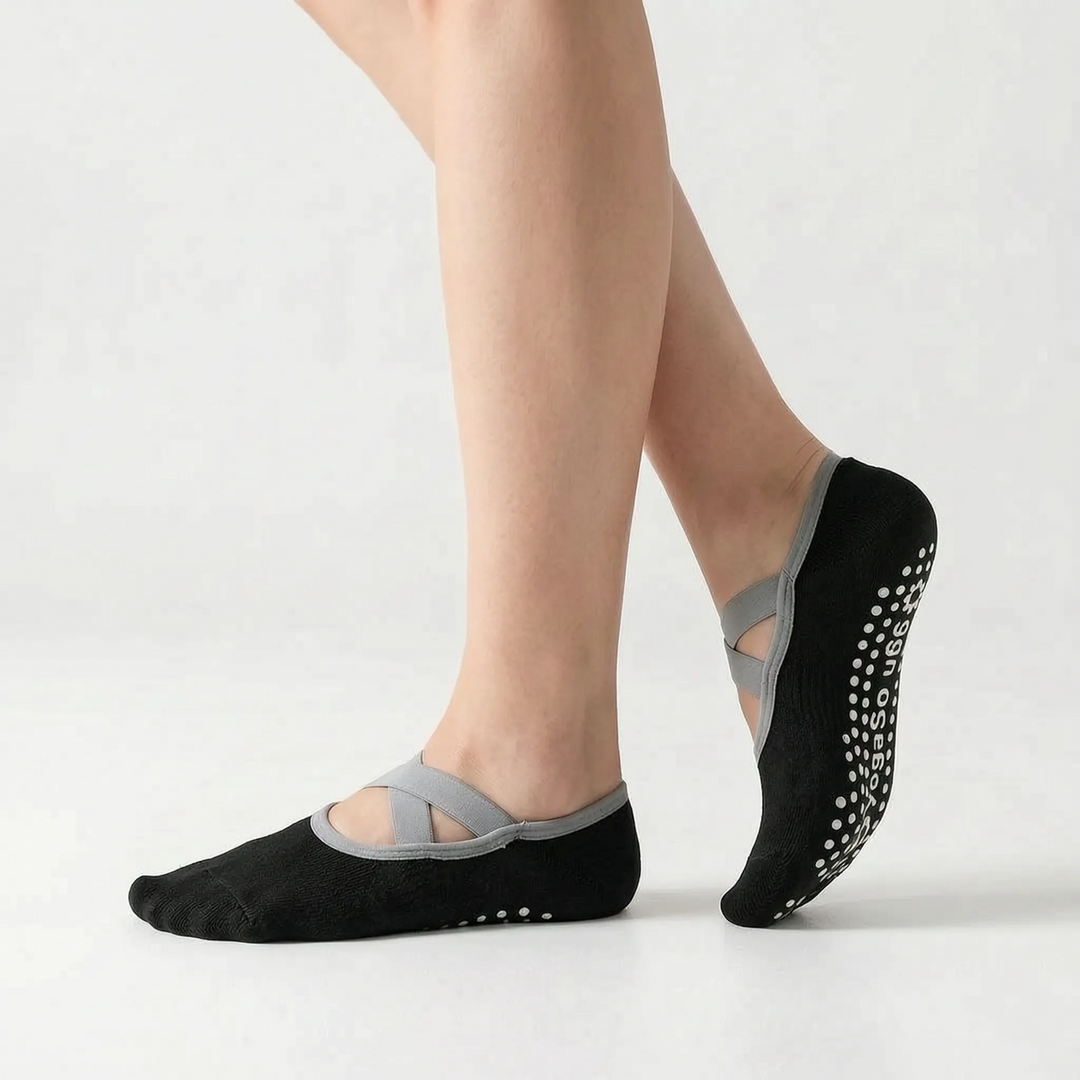 Full view of a pair of green women's non-slip athletic studio grip socks, perfect for activewear.