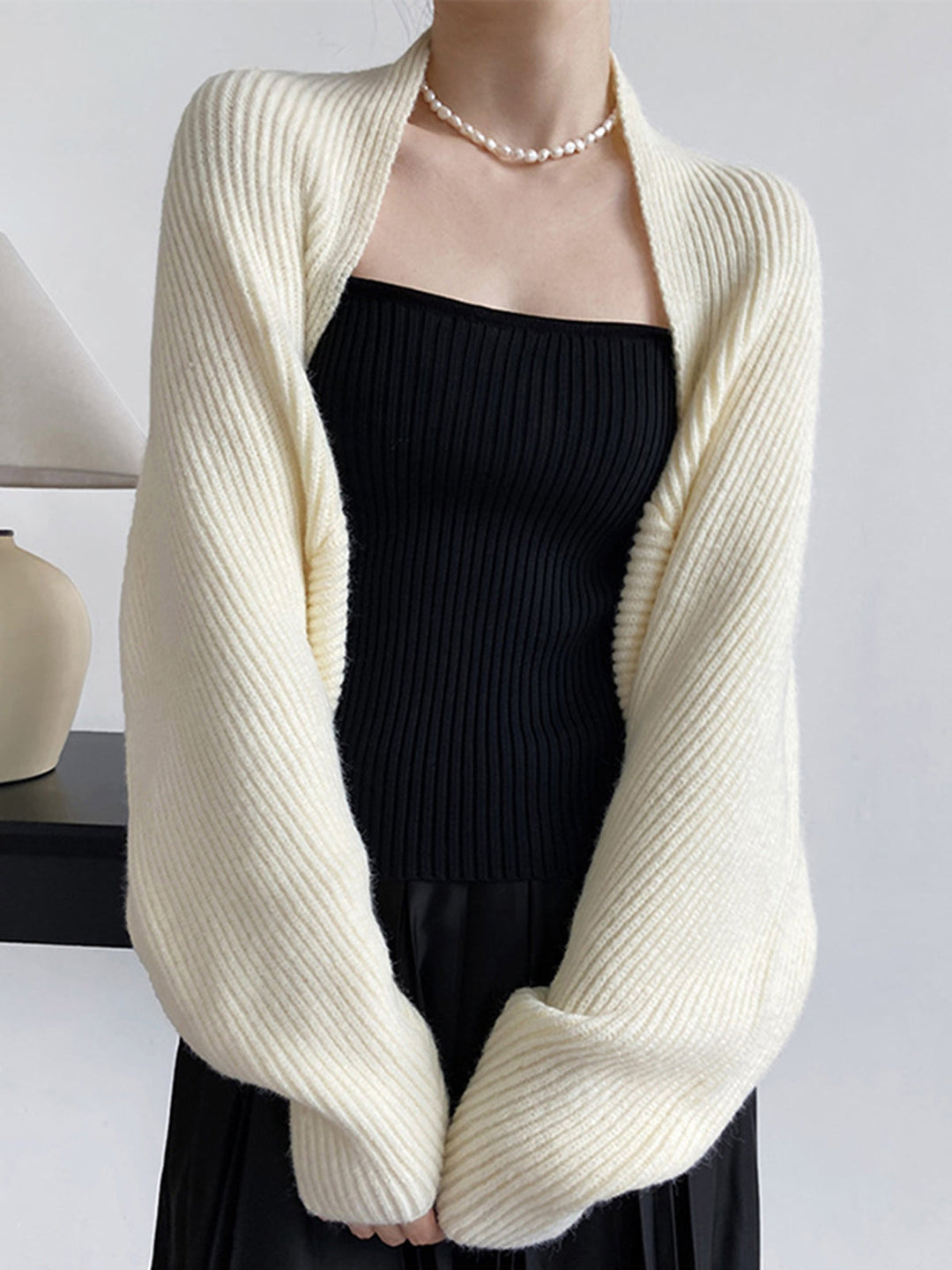 Casual women's open-front layering top, a regular fit long-sleeve shrug for comfort & style.