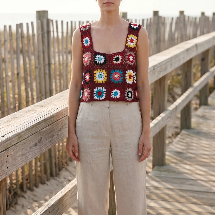 Women's open-knit sleeveless crop top, perfect for summer. Lightweight and versatile casual or beachwear.
