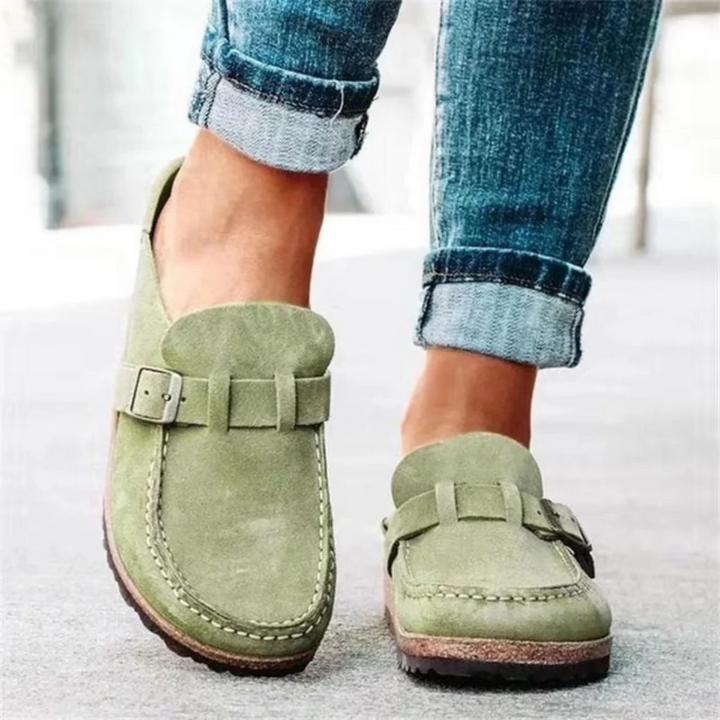 Women's orthopedic clogs with buckled strap for comfort. Ideal for everyday wear & foot health.