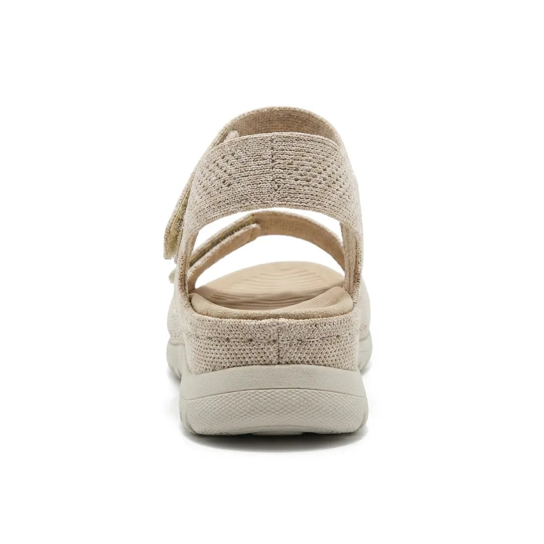 Women's orthopedic footwear: black adjustable hook-and-loop sandals with superior arch support.