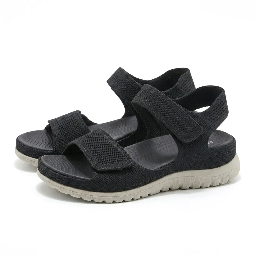 Lightweight women's orthopedic walking sandals, adjustable straps & supportive arch design.