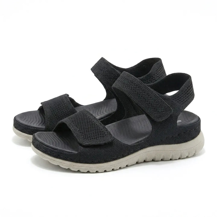 Lightweight women's orthopedic walking sandals, adjustable straps & supportive arch design.