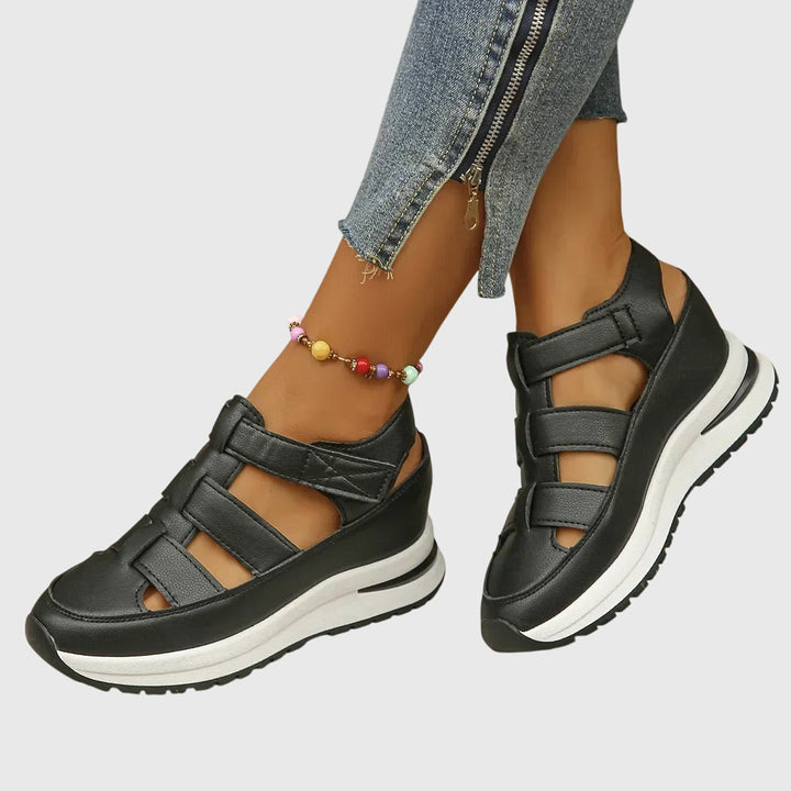 Women's orthopedic sandals with adjustable arch support for comfortable walking.