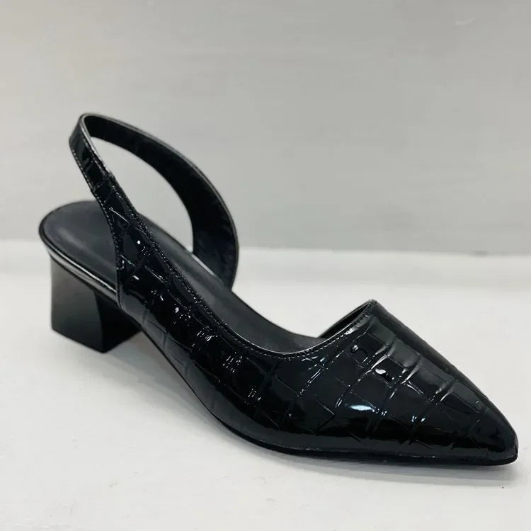 Chic black women's slingback heels with an embossed pattern. Orthopedic design for elegant comfort, ideal for formal events.