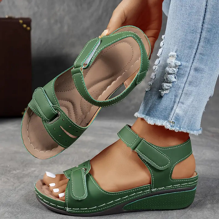 Comfortable women's orthopedic walking sandals with wedge heel, arch & foot support, adjustable strap.