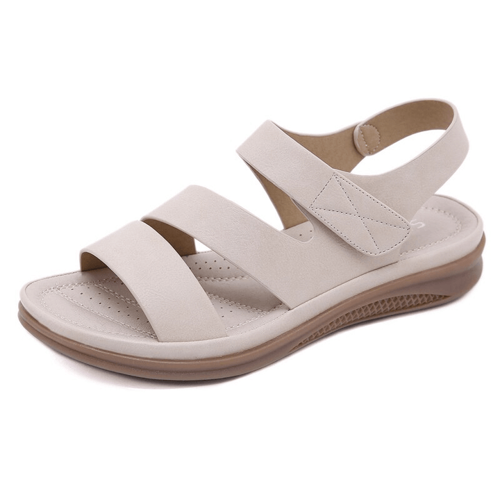 Top view of women's summer wedge sandals, showcasing the supportive arch and strap design.