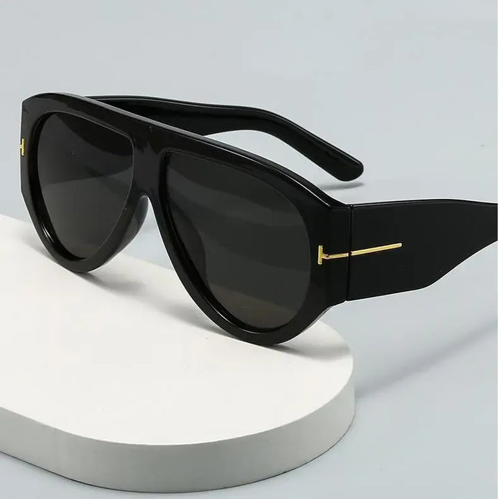 Women's oversized aviator sunglasses with chic metal frame, offering stylish UV protection.