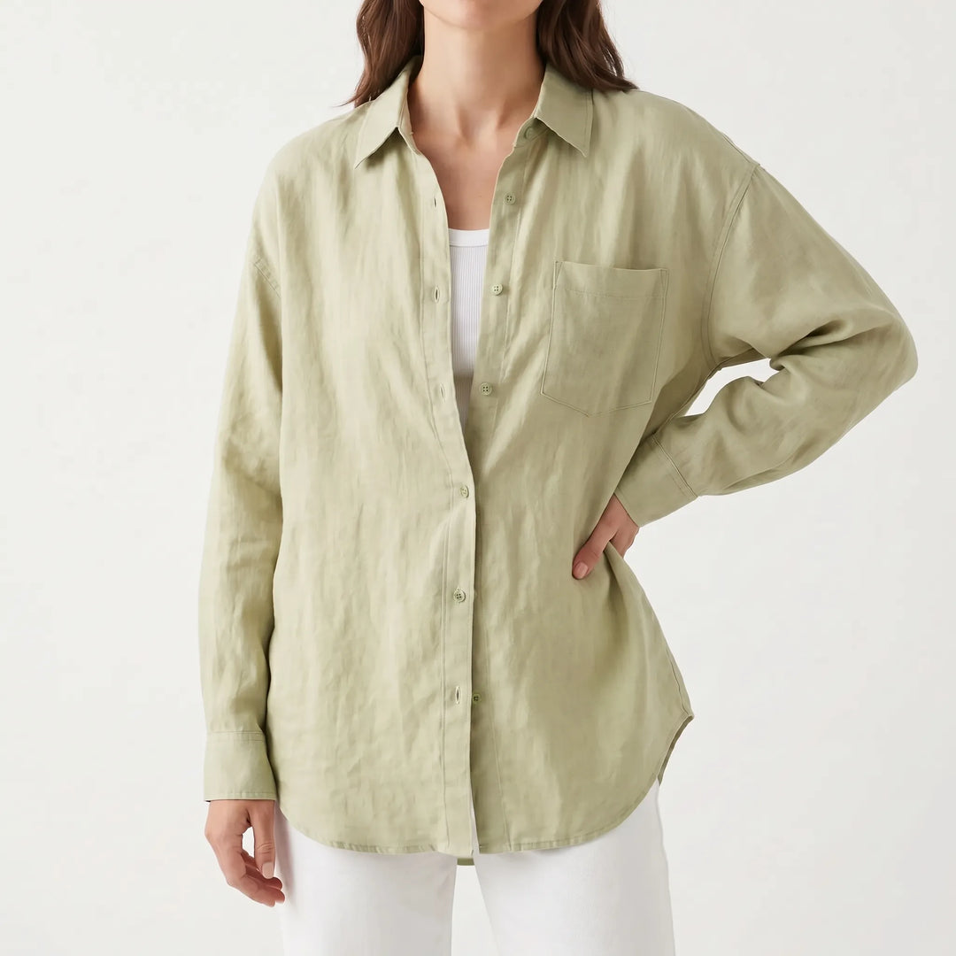 Stylish women's oversized button-down shirt in a solid color, ideal for versatile summer outfits.