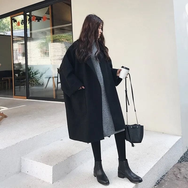 Classic oversized women's trench coat, offering an elegant and comfortable fit for fall & winter outerwear.