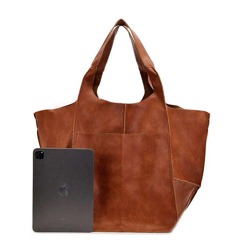 Women's oversized everyday shoulder bag, black. Spacious and stylish tote, perfect for daily essentials or work.