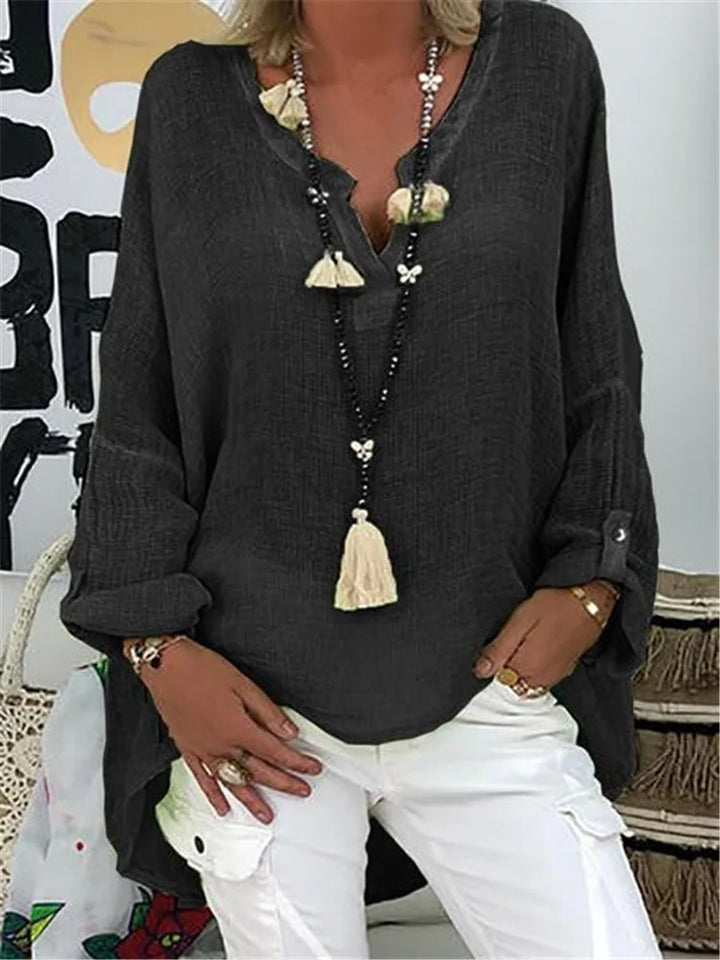 Chic women's oversized blouse, a versatile flowy top for casual elegance or stylish summer fashion.